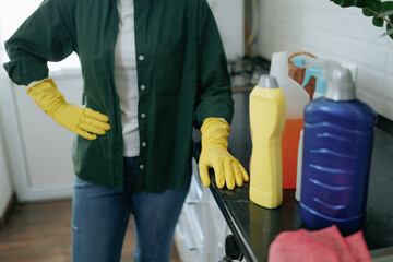 Fatigued Woman in Kitchen Taking a Break from Chores