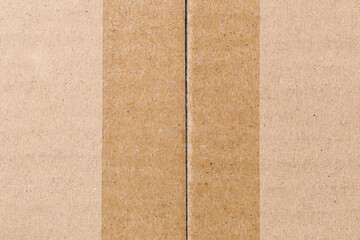 View top of cardboard with adhesive tape on it.