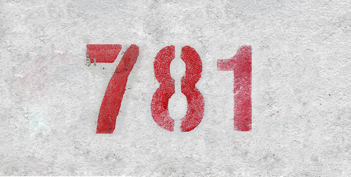 Red Number 781 on the white wall. Spray paint.
