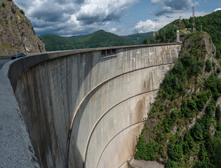 Crossing the impressive Vidraru Dam along the Transfăgărășan road (DN7C) in the Fagaras mountains, Transylvania, Romania