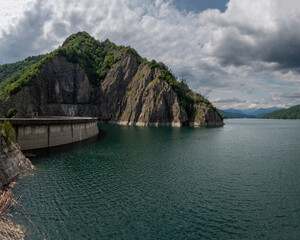 Crossing the impressive Vidraru Dam along the Transfăgărășan road (DN7C) in the Fagaras mountains, Transylvania, Romania