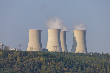 Dukovany nuclear power plant in the Czech Republic, Europe. Smoke cooling towers. There are clouds...