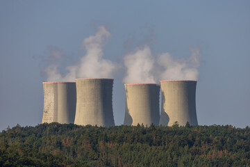 Dukovany nuclear power plant in the Czech Republic, Europe. Smoke cooling towers. There are clouds...