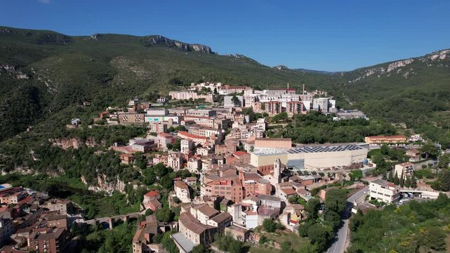 Tilt down aerial shot of La Riba town on sunny summer day. Tarragona Province, Spain.