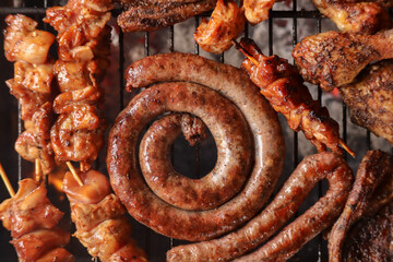 sausages on the grill. South African braai meat including Boerewors, kebabs and chops 