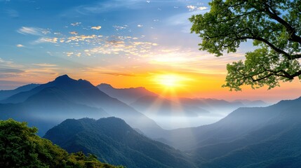 Breathtaking mountain sunrise landscape with misty valleys, colorful sky, and lush greenery. Peaceful nature scenery perfect for relaxation.