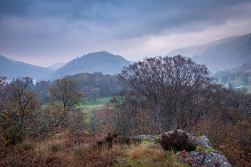 Cloudy, autumnal scene in the mountains during sunrise in the Lake District National Park