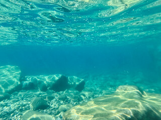 Fototapeta premium Pebble beach seen from the water.