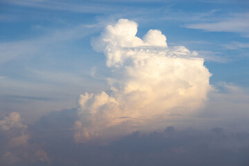 Beautiful clouds adorn the blue afternoon sky.