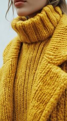 A woman in a yellow sweater with a knit collar