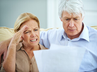 Old couple, frustrated and finance paperwork in home, debt payment fail and tax audit mistake....