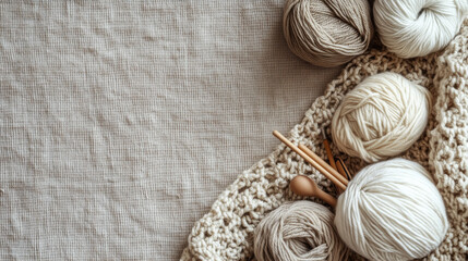 assorted neutral color knitting twisted yarns and crochet tools on linen cotton background with copy space for background, website design banner