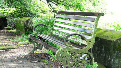 An abandoned steel bench aside the park
