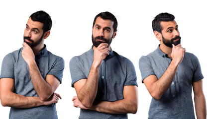 set of handsome brunette man with beard looking to side and thinking 