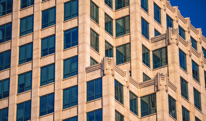 Windows and Facade on a Brownstone Building in Sunlight.