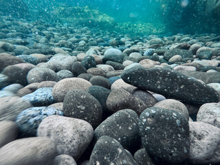 Pebble beach seen from the water.
