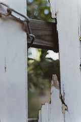 Hole in a broken wooden door