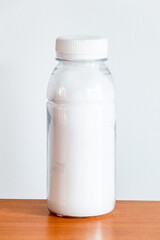 Plastic bottle with a sample of white substance.