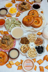 Meal with traditional Kyrgyz dishes served in the yurt. Local food in Kyrgyzstan.