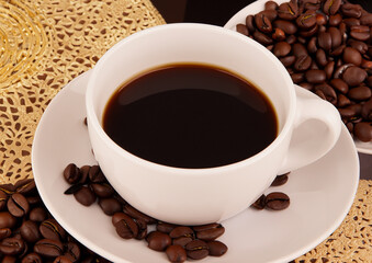 Fototapeta premium some coffee beans and a cup of coffee