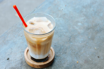 Iced cofee milk with palm sugar on the table. Eskopi gula aren pandan
