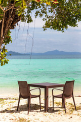 Table setting at tropical beach restaurant.