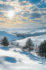 Fototapeta premium Stunning winter landscape with snow-covered hills and sunlight at dawn
