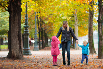 Mother and baby in autumn. Fall outdoor family fun.