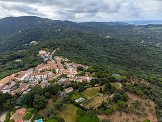 Aerial view on green hills, houses, gulf of saint-tropez, Gassin village, vineyards, Provence, Var, France