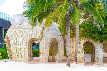Tropical beach with beautifully designed pergola in Mexico.
