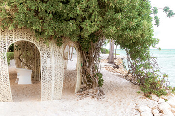 Tropical beach with beautifully designed pergola in Mexico.