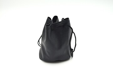 A black leather drawstring bag with a minimalist design is displayed against a white background