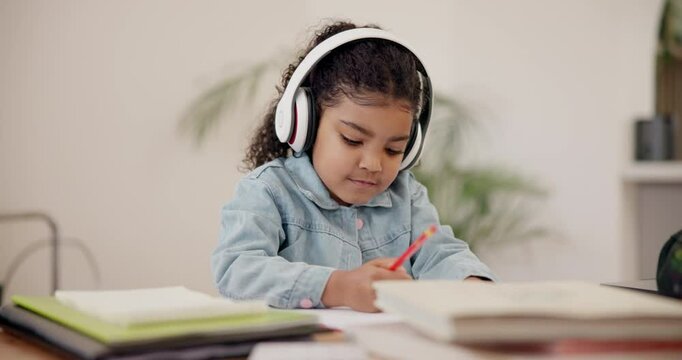 Girl, child and writing with headphones or book in education, learning or homework at house. Female person or little kid thinking with headset or notebook in creative development or elearning at home