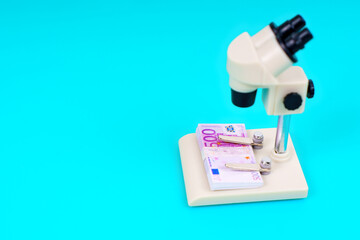 Microscope Analyzing Euro Banknotes For Counterfeit Checks