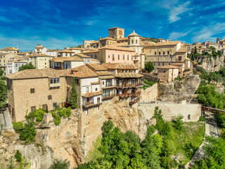 Fototapeta premium Aerial view of Cuenca historic town center with in La Mancha Spain, colorful medieval houses with hanging balcony blue cloudy sky