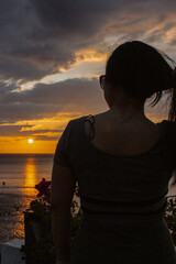 Fototapeta premium PG Island, Oriental Mindoro Province, Philippines - Silhouette of people on the beach at sunset