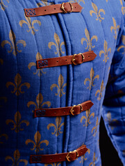 Historical fashion. Medieval knight cloth. Padded jacket gambeson.