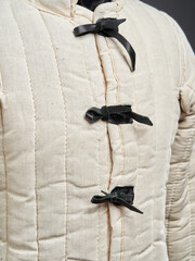 Historical fashion. Medieval knight cloth. Padded jacket gambeson.