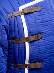 Historical fashion. Medieval knight cloth. Padded jacket gambeson.