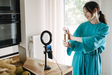 Beauty influencer demonstrating skincare product with ring light setup, content creation, social media marketing, micro-influencer strategy, brand promotion.