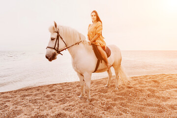 A white horse and a woman in a dress stand on a beach, with the