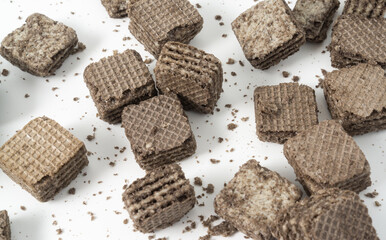 Biscuits chocolate with crumbs on white background. It is a chocolate cookies with a sweet cream.