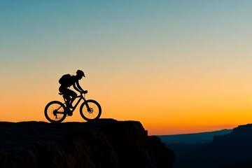 Fototapeta premium Silhouette of A man is riding a bike on a mountain trail