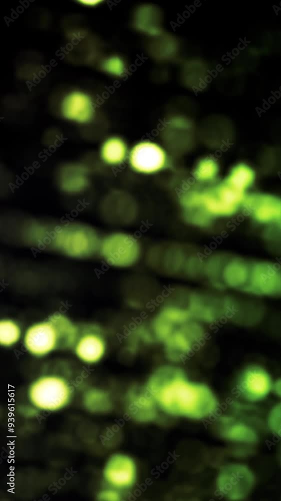 Poster Colorful rows of small dots rotating on black background, seamless loop. Animation. Green bokeh cloud spinning and moving.