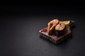 Delicious red salmon r trout fish grilled with spices and herbs