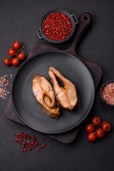 Delicious red salmon r trout fish grilled with spices and herbs