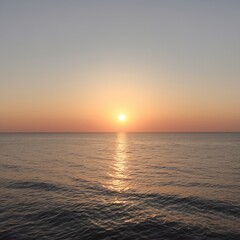 Obraz premium A peaceful seascape with a sunset, symbolizing relaxation and tranquility.