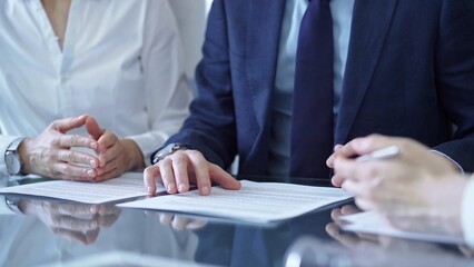 Business people and lawyers a contract papers before signing the agreement. Teamwork concept