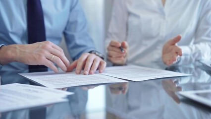 Fototapeta premium Business people are reviewing a contract and discussing the terms of the agreement. Lawyers at work