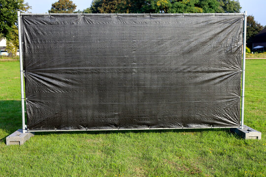 Blinded fence with concrete bases; iron fencing; construction barrier; pre-galvanized construction fence; construction fence base.